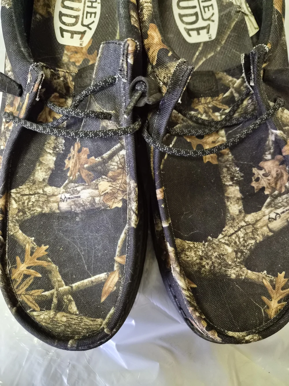 Hey Dude Men’s Camouflage Slip-On Loafers in Black and Brown